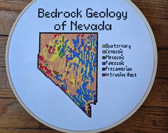 Nevada Bedrock Geology completed cross stitch, framed in 9 inch hoop