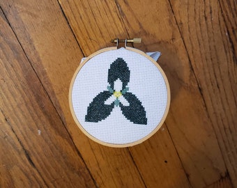 Trillium, completed cross stitch, framed in 4 inch hoop