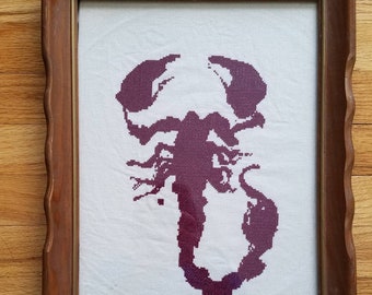 Framed scorpion blood glyph Penny Dreadful completed cross stitch