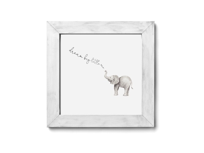 May include: A white framed print with a watercolor illustration of a gray elephant with the text "dream big little one" written in cursive.