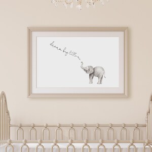 May include: A framed print with a gray elephant illustration and the text "dream big little one" in cursive.