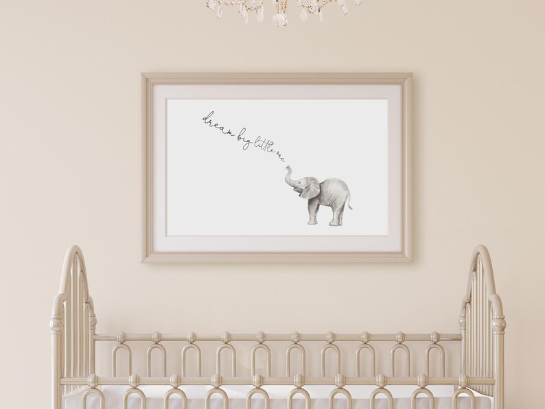 May include: A framed print with a gray elephant illustration and the text "dream big little one" in cursive.