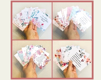 May include: Set of floral-themed cards with inspirational quotes. The cards feature watercolor floral designs in shades of pink, blue, and green. The quotes are printed in black text.