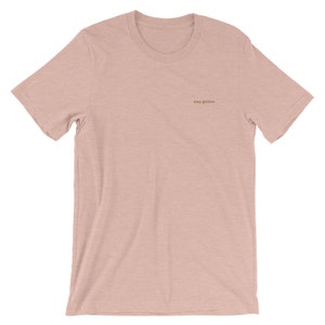 Heather Prism Peach short-sleeve tee with the phrase Stay Golden embroidered in gold thread.