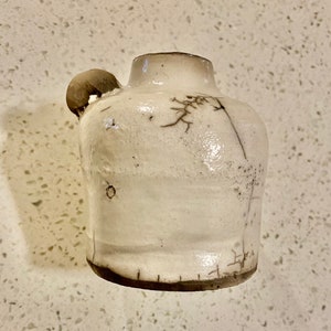 Mini naked Raku pottery whiskey jug
