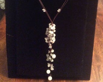 geometric bohemian styled glass and rose quartz necklace .