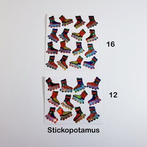 May include: A sheet of colorful roller skate stickers with a holographic finish. There are 16 stickers on the top sheet and 12 on the bottom sheet. The text "Stickopotamus" is printed at the bottom of the sheet.