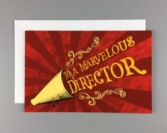 Op de afbeelding: Een rode en gele kaart met een megafoon en de tekst "To a Marvelous Director".