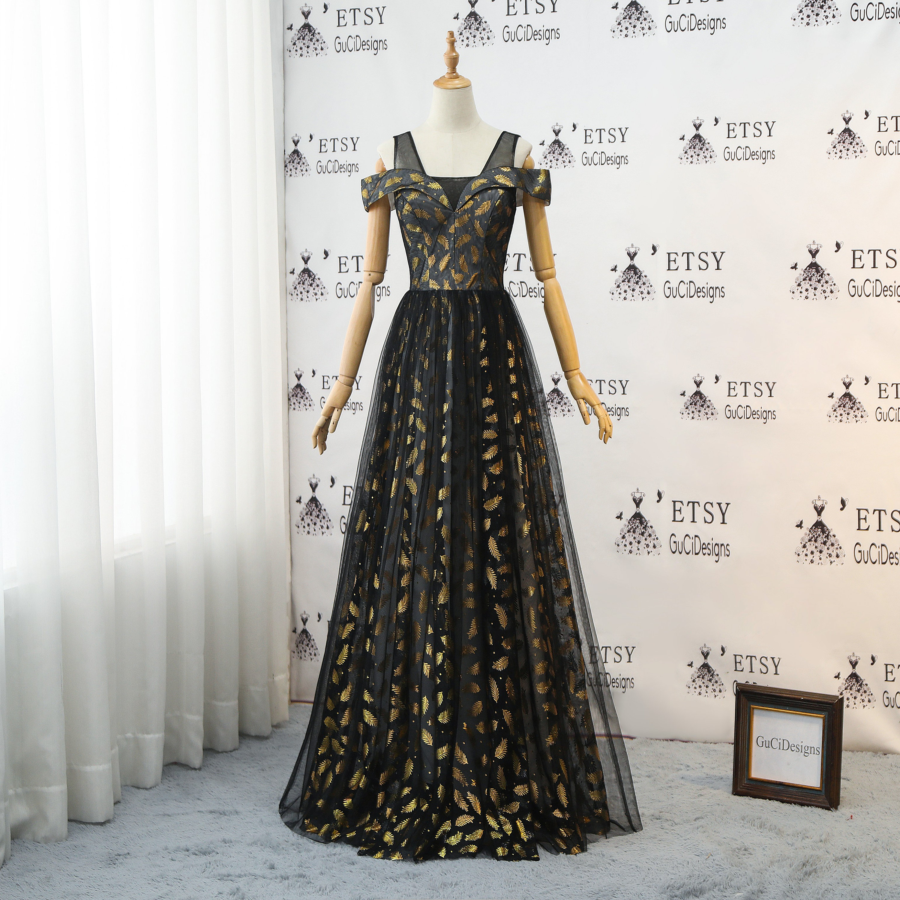 black dress with gold leaves
