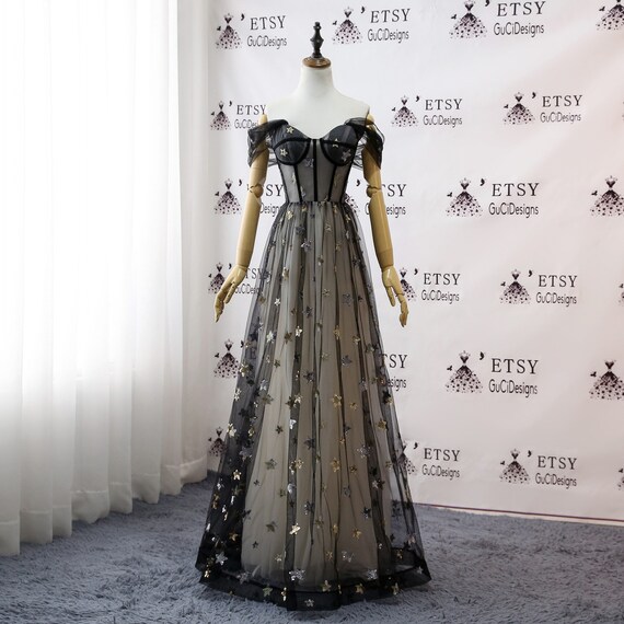 black dress with gold stars