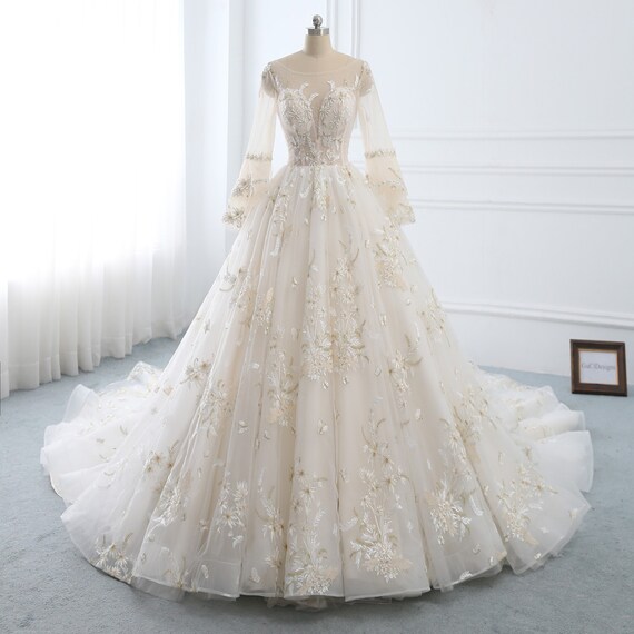 white and gold lace wedding dress