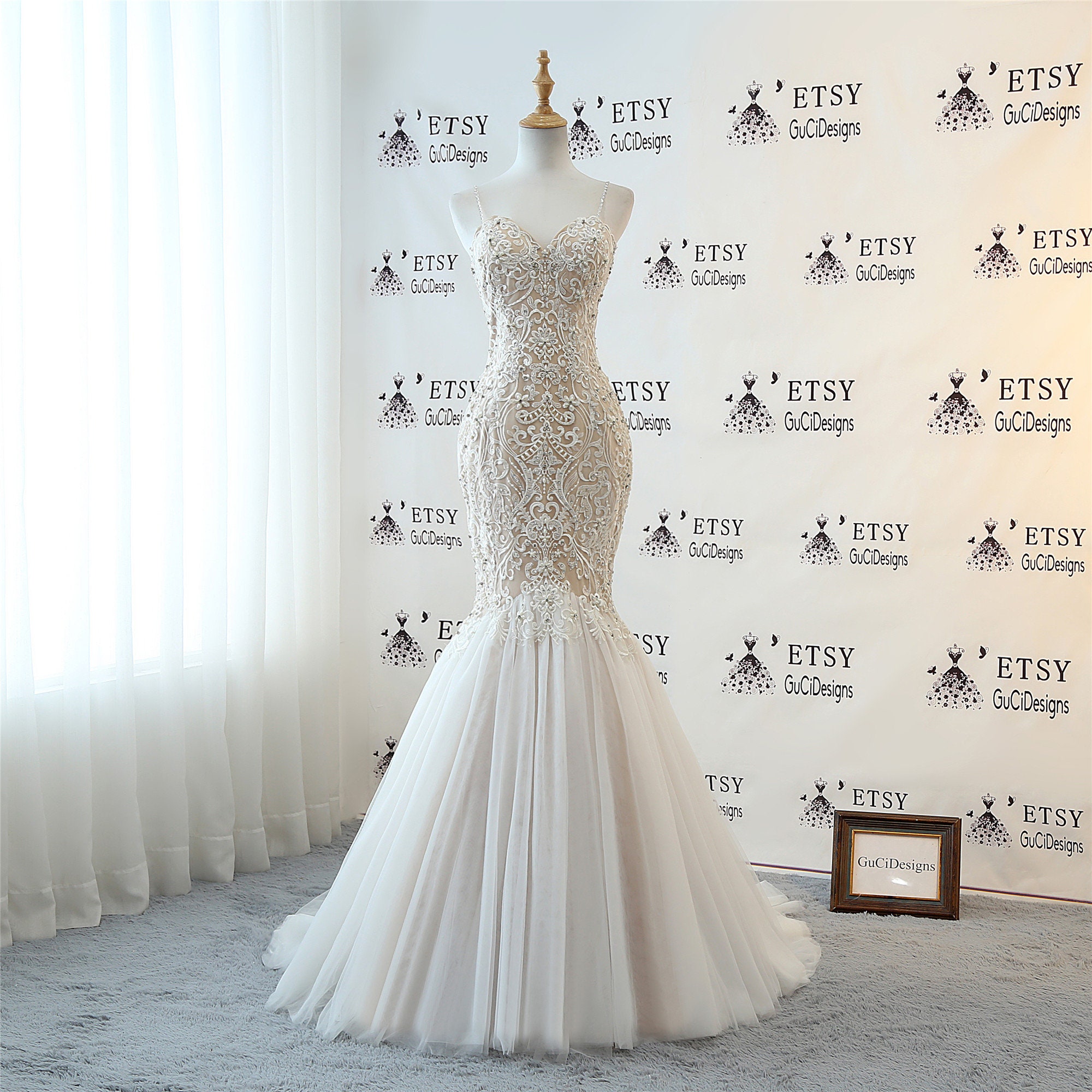 spaghetti strap trumpet wedding dress