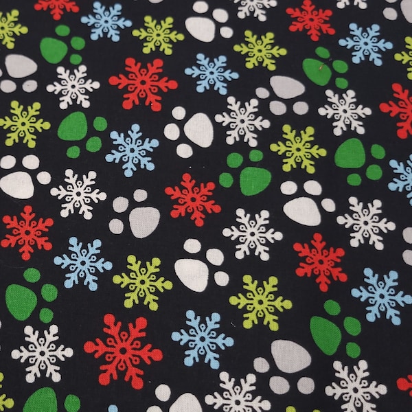 Colorful Paw Prints and Snowflakes in Christmas Colors on Black Background Cotton Fat Quarter, 18 Inches x 21 Inches