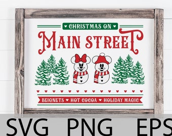 May include: A wooden sign with the text "Christmas on Main Street" in red letters. The sign features a pair of Mickey Mouse and Minnie Mouse characters dressed as snowmen with red scarves and hats. The sign also includes the text "Beignets, Hot Cocoa, Holiday Magic" in red letters.