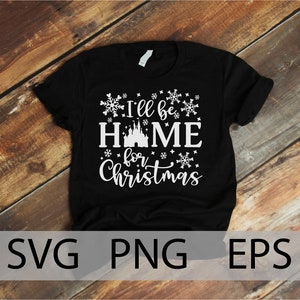 May include: Black t-shirt with white text that reads "I'll be home for Christmas" with a white silhouette of Cinderella's castle and snowflakes.
