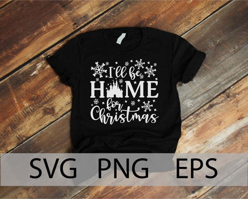 May include: Black t-shirt with white text that reads "I'll be home for Christmas" with a white silhouette of Cinderella's castle and snowflakes.
