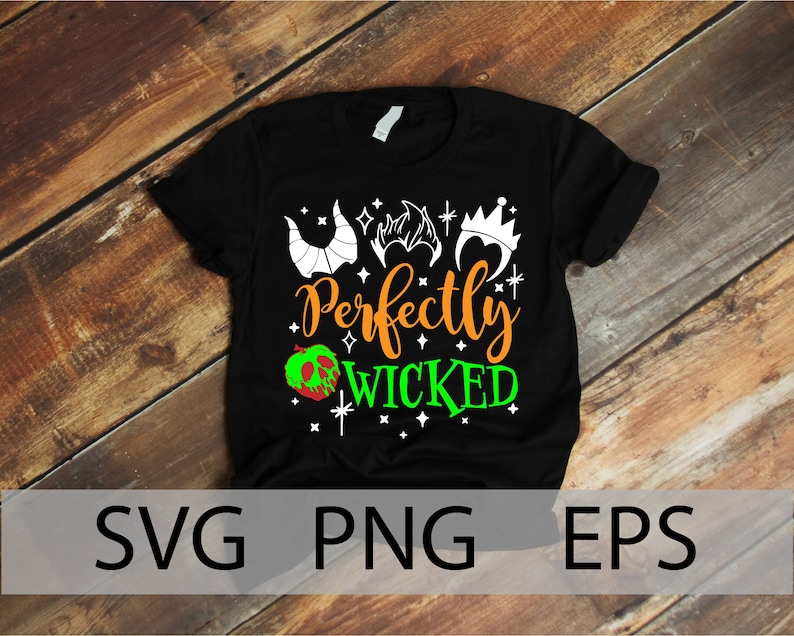 K&ouml;nnte beinhalten: Schwarzes T-Shirt mit einem wei&szlig;en Grafikdesign mit einem gr&uuml;nen Apfel, einer Krone und H&ouml;rnern. Der Text "Perfectly Wicked" ist in Orange und Gr&uuml;n geschrieben.