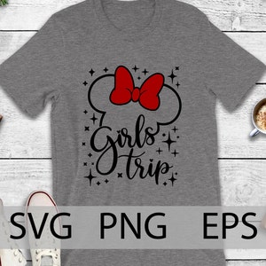 May include: Gray t-shirt with a black and red graphic design. The graphic features a red bow, black ears, and the text "Girls Trip" with black stars.