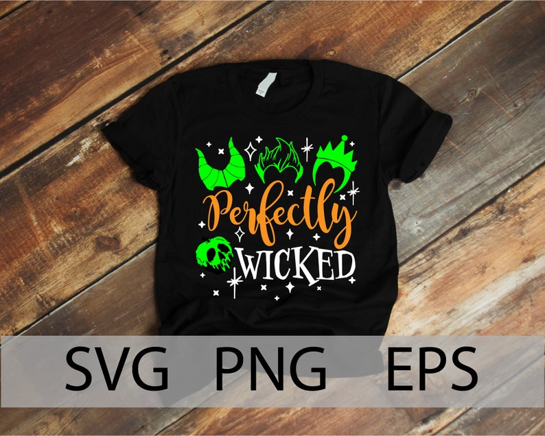K&ouml;nnte beinhalten: Schwarzes T-Shirt mit einem gr&uuml;n-wei&szlig;-orangenen Design. Das Design zeigt eine Silhouette von drei Disney-Schurkenk&ouml;pfen mit dem Text "Perfectly Wicked".