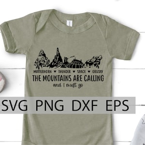 May include: A green baby onesie with a black design of a mountain range and the text "MATTERHORN THUNDER SPACE GRIZZLY THE MOUNTAINS ARE CALLING and I must go".