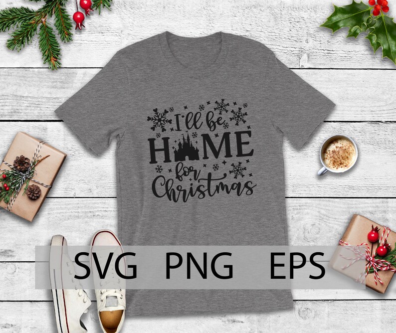 May include: A gray t-shirt with a black graphic that says "I'll be home for Christmas" with a silhouette of a castle in the middle of the word "home".