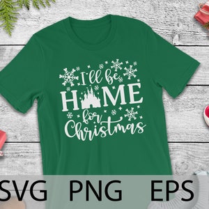May include: Green t-shirt with white text that reads "I'll be home for Christmas" and a white silhouette of a castle.