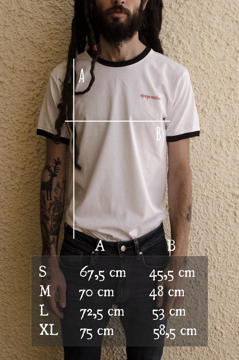 May include: White t-shirt with black trim around the neck and sleeves. The shirt has the text "apoyo mutuas" printed on the front. Size chart with measurements in centimeters for different sizes: S, M, L, XL.