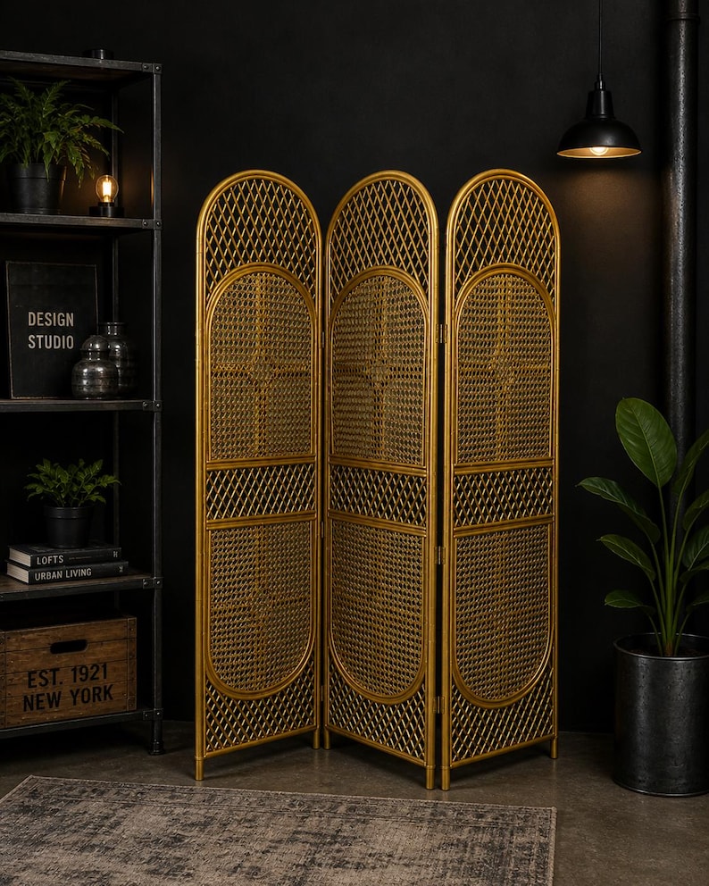 May include: A three-panel, gold-colored room divider. The screen features a woven rattan design with arched top and bottom sections. The frame is a warm gold color, and the overall style is vintage and decorative.