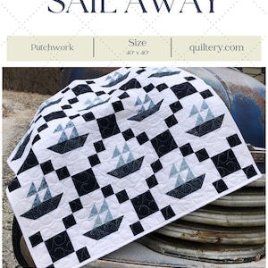 Peut inclure: Une courtepointe en patchwork noir et blanc avec un motif de voilier. La courtepointe mesure 40 pouces sur 40 pouces et s'appelle "Sail Away".