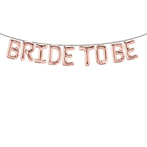 May include: Rose gold foil balloon banner that reads "Bride to Be".