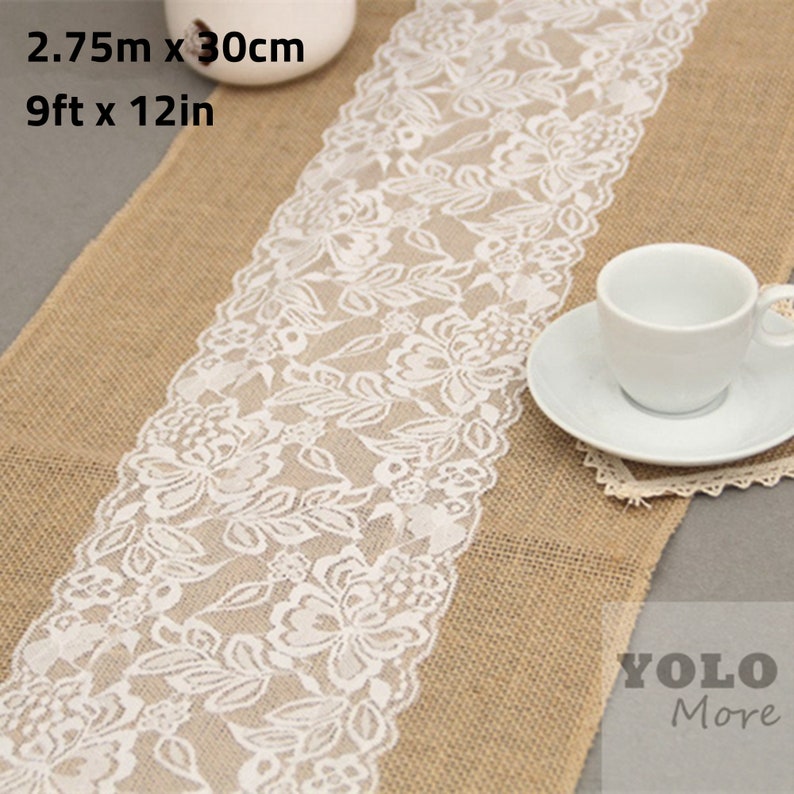May include: A burlap table runner with a white lace trim. The runner is 9 feet long and 12 inches wide. The runner is shown on a table with a white teacup and saucer.