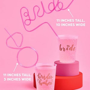 May include: Pink plastic cups with gold glitter and the text "bride" and "brides babes" printed on them. Pink bendy straws shaped like the word "bride" are included. The cups are 11 inches tall and 3 inches wide. The straws are 11 inches tall and 10 inches wide.