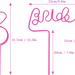 May include: Two pink plastic straws shaped into a ring and the word "bride". The straws are 12.5 inches tall and the bride straw is 9.8 inches wide.