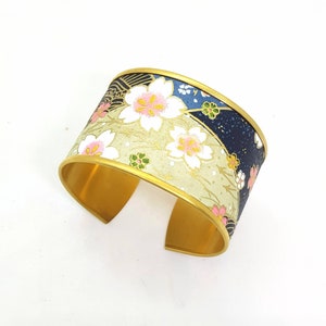 Cuff bangle bracelet, brass, Japanese paper, cherry blossoms, blue and gold, origami