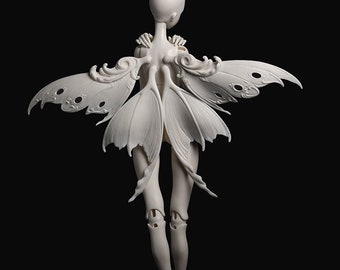 May include: A white doll with articulated joints and a fairy-like design. The doll has a smooth, matte finish and features intricate wing details. The text "DOLL CHATEAU" is at the top of the image.