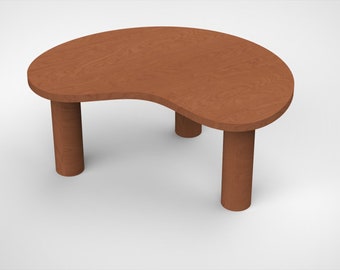 Kidney-shaped wooden coffee table with 3 cylindrical legs in stained oil finish