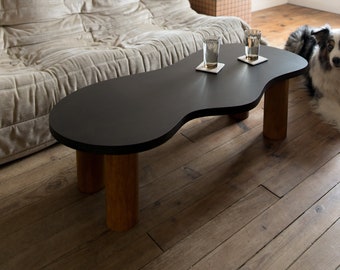 Wooden coffee table with organic shape and pretty curves, two-tone tinted oil finish