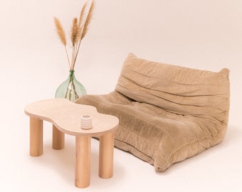 Small wooden coffee table with organic shape and pretty curves