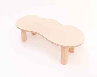 Large wooden coffee table with organic shape and pretty curves