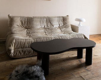 Wooden coffee table with organic shape and pretty curves, tinted oil finish