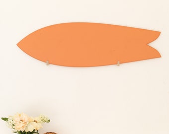 Orange decorative surfboard in wood