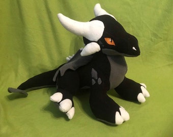 dragonite plush holding dratini