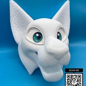 May include: A white, textured animal mask with large ears and teal eyes. The mask has a detailed, porous surface. A QR code with the text "SCAN ME" is in the lower right corner.