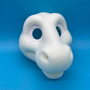 May include: White unfinished foam dragon fursuit head with large eye holes and a small snout.