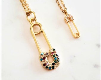 Gouden veiligheidsspeldketting: sierlijke gelaagde bedel, minimalistische ketting