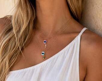 Collar de cristal de Murano con ojo turco: cadena de acero inoxidable, perla de agua dulce.