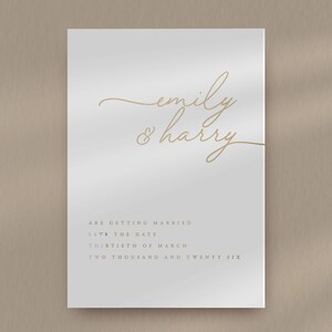 a white card with gold foil on it