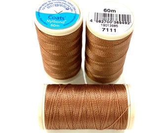 May include: Three spools of brown Coats Nybond thread, each 60m long. The spools have a blue and white label with the brand name and length.