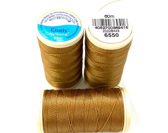 May include: Three spools of brown Coats Nylonbond thread, each measuring 60m. The spools have white labels with the brand name, thread type, and length printed on them.