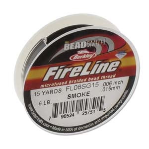 May include: A spool of FireLine microfused braided bead thread in Smoke color. The label indicates 15 yards of thread, 0.006 inch in diameter, and a 6 lb test. The brand name is Beadsmith.